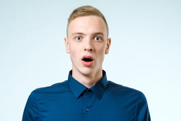 Wall Mural - Portrait of young amazed man