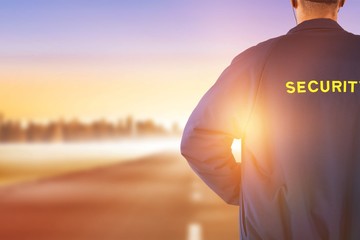 Poster - Composite image of rear view of security officer in uniform