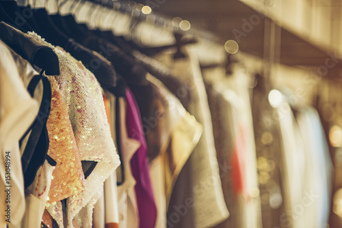 Cuadros en Lienzo Women boutique shop concept - colorful clothing on hangers.