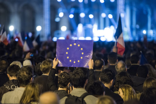 EU flags and France flags shown on a demonstration in Paris.