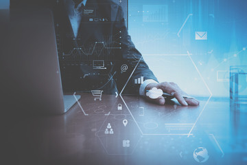 Poster - businessman working with mobile phone and digital tablet and laptop computer on wooden desk in modern office with VR icon and chart diagram