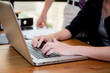 © NT_studio - Closeup computer notebook in office with woman for work.
