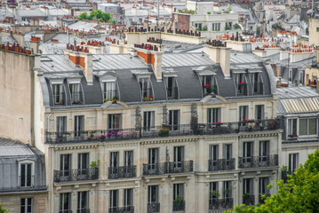 Old traditional Paris building smokestacks flats