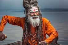 Portrait Of Sadhu Rowing In The Boat, Varanasi, India.