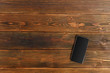 © fotofabrika - mobile phone on a wooden table
