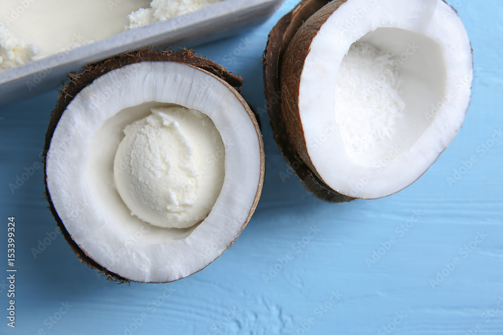 Coconut ice cream and fresh nut on wooden table