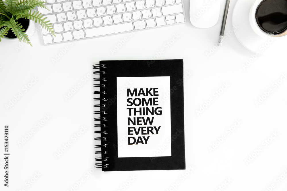 Top view of make something new everyday motivational quote, computer ...