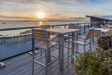 Rooftop Deck With Water View At Sunset