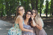 © Prostock-studio - Three beautiful young boho chic stylish girls walking in park.