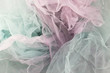 Vintage tulle chiffon background texture. The concept of a wedding. Vintage filtered and toned image. Fabric in the form of a rainbow with a light overflow. Multicolored tulle