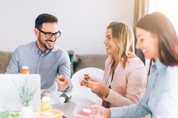 Work team having lunch break
 