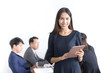 © Jestercine - Beautiful asian business woman using tablet with leader concept and a group of person, 20-30 year old.
