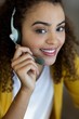 © WavebreakMediaMicro - Smiling customer service executive talking on headset in office