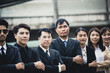 © Jestercine - Asian business team standing together, protrait business people concept, vintage tone.