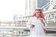 © Jestercine - Arab man drinking coffee and rest in the city, 20s age.