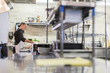 © Cavan Images - Female chef working in restaurant kitchen