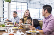 © Cavan Images - Children and parents enjoying at restaurant