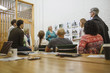 © Cavan Images - Business woman presenting layouts in conference room