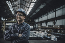 Portrait Of Male Worker Standing In Metal Industry