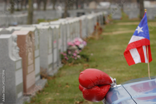 Boxing Gloves And A Puerto Rican Flag Are Seen On A Car During The