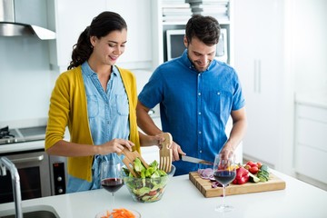 Couple cooking together in the kitchen