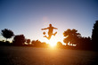 © OscarStock - Man playing with soccer ball in the park..