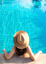 Women Relaxing Near Luxury Swimming Pool