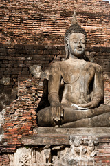 Wall Mural - Sukhothai historical park the old town of Thailand Ancient Buddha Statue at Wat Mahathat in Sukhothai Historical Park,Thailand