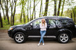 © F8  \ Suport Ukraine - Young woman standing next to her new car on street