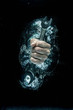 © Connect Images - Male hand gripping wrench beneath water