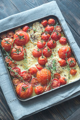 Wall Mural - Fresh tomatoes, feta, garlic and thyme on the tray