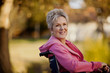 © Erickson Stock - Smiling senior woman sitting in a wheelchair.