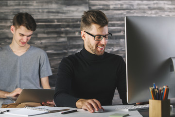 Canvas Print - Cheerful men using devices