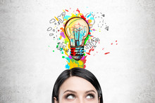 Woman With Black Hair And Colorful Light Bulb