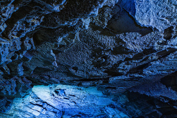 Inside an ice cave . The ice is thousands of years old and so packed it is harder than steel and crystal clear.