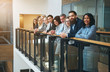 © Flamingo Images - Multiethnic office team smiling and standing together