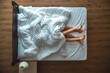 © realstock1 - The lovers lay under blanket on the bed. view from above