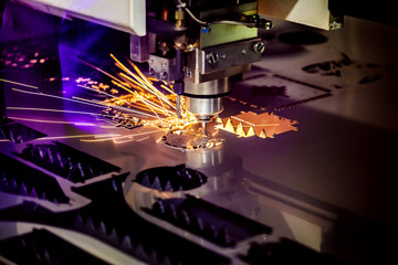 CNC Laser cutting of metal, modern industrial technology.