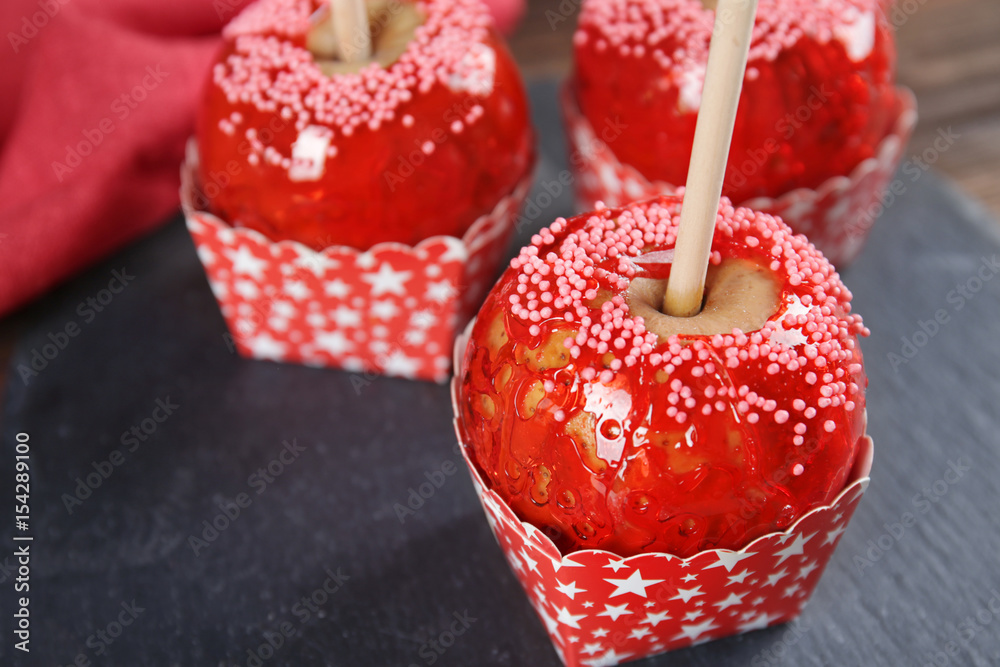 Slate plate with candy apples, closeup