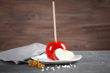 Sticker - White saucer with candy apple on grey table