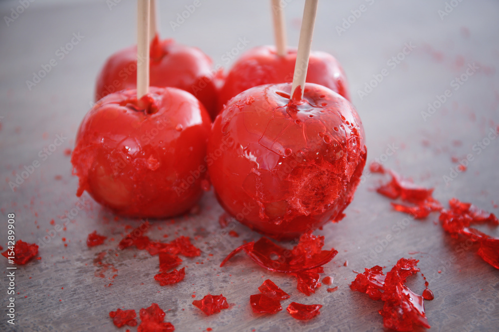 Candy apples on grey background