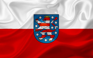 flag of thuringia, germany, with waving fabric texture