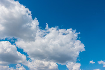 Wall Mural - blue sky background with white clouds