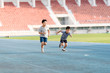 © TinPong - Boy running on the blue track