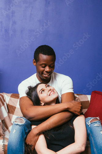 Young Happy Couple In Love Black Man And White Woman Cuddle And