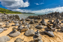 Stacked Balancing Rocks On The Beach Between Cairns And Port Douglas, Australia