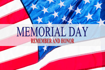 Text Memorial Day and Honor on flowing American flag background. Concept of Memorial day or Veteran's day in America.