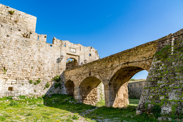 Canvas Print - Gate of Saint John, bridge leading to it and moat at Rhodes old town, Rhodes island, Greece