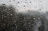 Fototapeta Tęcza - Drops of rain on the window