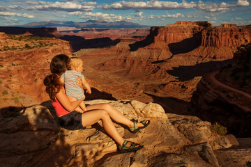 Poster - A mother and her baby son visit Canyonlands National park in Utah, USA